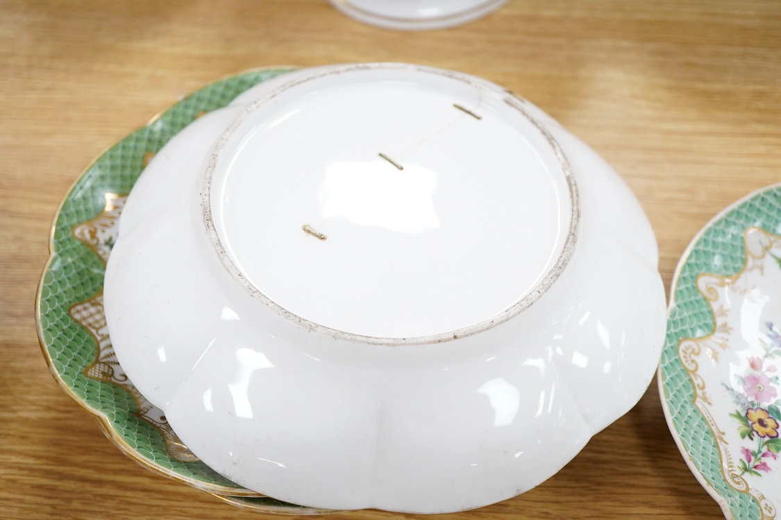 A 19th century French Paris porcelain part dessert service with green scale borders by Nast Paris, largest 26cm wide